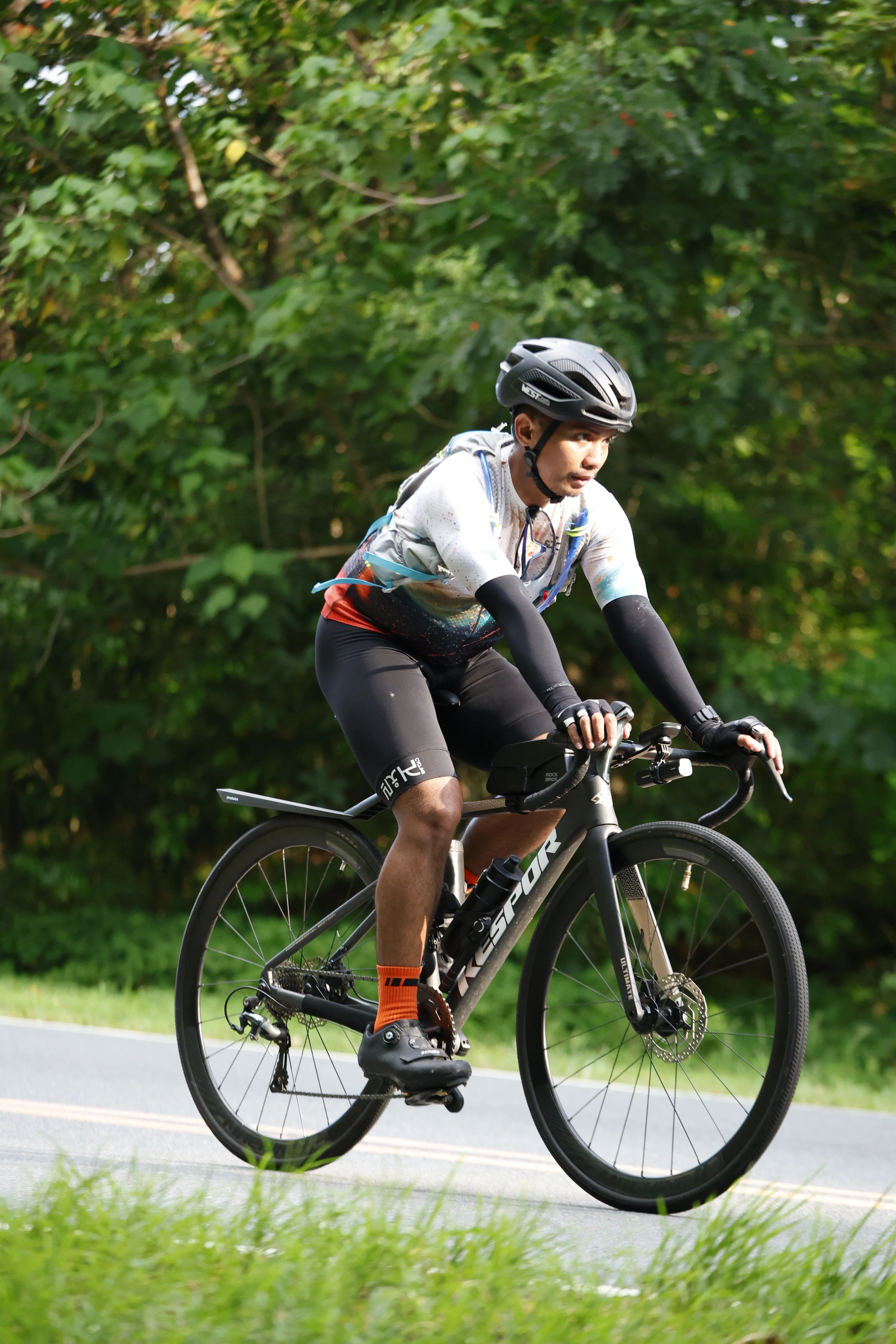 Brian Hiramis riding with his road bike.